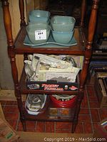 Full view of shelving with bowls and other items seen
