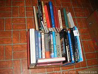 Box of assorted books including history, mythology, oil lamps, with titles such as 'Canada', 'Life in the United States', etc.