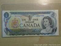 Front view of 1973 Canadian one dollar bank note showing detailed portrait and serial number ECS0857790.