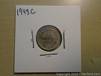 Reverse side of the 1943C Canadian silver 10 cents coin showing denomination and year 1943 with leaf decorations.