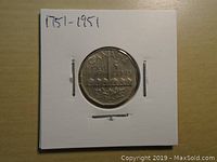 Photo of the coin's reverse side showing the maple leaf design and inscriptions.