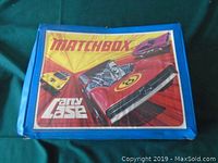 Closed blue plastic Carry Case with colorful Matchbox decal on lid
