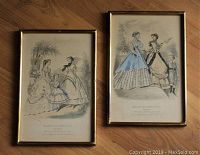 Pair of two framed French fashion engravings from 1866 on wooden floor.