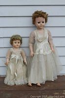 Both vintage dolls shown side by side, displaying height difference and outfits.