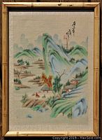 Full frontal image of the signed Asian landscape painting with bamboo frame showing the composition and calligraphy in good condition.