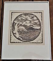 Full view of the framed etching art piece showing the subject artwork behind glass within a white mat and brown frame.