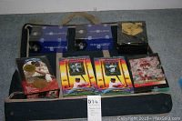 Wide shot showing entire lot - two unopened Topps Upper Deck boxes, framed Hank Aaron card, multiple loose 1994 batting lineup cards, and unopened 1993 Update Frank Thomas box.