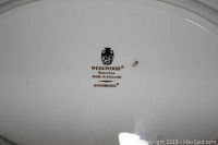 Underside of bone china piece showing Wedgwood backstamp with 'KINGSBRIDGE' and item number '138'