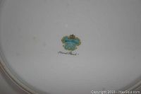 Backstamp on bottom of dish showing Meito China mark with text 'Hand Painted' indicating authenticity and origin.