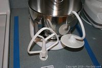 KitchenAid Ultra Power mixer with paddle, dough hook, and wire whip attachments arranged in front of the mixer.