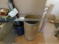 10 Lynx golf clubs in a bucket, showing overall condition and grips