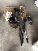 Photo of the full golf club set including the golf bag, several clubs and accessories on a carpeted surface.