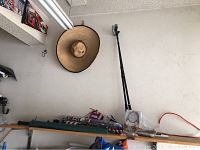View of the lot showing the sombrero hat, flag poles, and flags arranged against a wall.