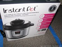 Box for Instant Pot Lux Mini 6-in-1 programmable pressure cooker, 3 quart capacity, showing branding and product features.