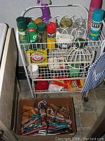 Metal storage rack containing spray bottles, glass jars, bug spray cans, and cleaning supplies