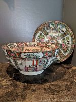 Bowl and platter shown together, displaying overall appearance and painted detail