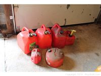 Overview of all six gasoline containers showing size variations and condition
