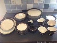 Full set of Gemini mid-century Japanese fine china displayed, showing plates, bowls, cups, creamer, and sugar bowl.