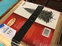 Boxed Holiday Living 9 ft Forest Fir artificial Christmas tree with product image and details.