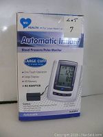 Front view of the MD Health box showing product name, cuff size (large 13-17 inches), features, and image of device with cuff.