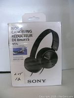 Front view of the sealed original box featuring branding, noise cancelling feature, and product image.