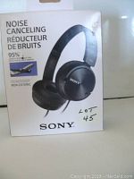 Front of box showing Sony MDR-ZX110NC noise cancelling headphones, model number and noise reduction claim of 95%.