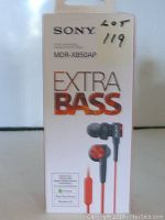 Front view of Sony MDR-XB50AP Extra Bass in-ear headphones retail box with red earbuds image and branding.