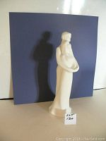 Front view of the Royal Doulton "Two Become One" figurine showing the couple embracing.