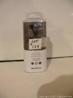 Front view of Sony MDR-EX110AP headphones in clear plastic retail packaging showing model and compatibility for smartphones