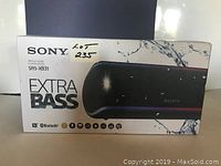 Front view of the Sony SRS-XB31 Extra Bass speaker box showing product image, logo, and lot number 235.