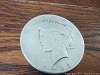 Obverse side of 1922 Liberty Peace Dollar showing the Liberty head with crown and date 1922.