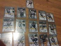 Full layout of all 21 autographed Cougars hockey cards, showing player images and signatures.