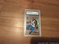Front of graded Josh Howard basketball card showing player in Dallas Mavericks jersey, with GMA grade 10 label on top.