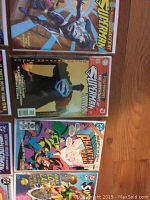Top down view of 7 comics, featuring Superman and Phantom Zone cover art, arranged in two rows