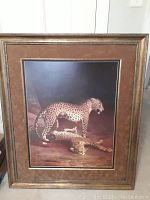 Full view of framed print showing two leopards on brown background.