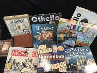 Large variety lot of board games, Puzzle and card games in original boxes arranged together showing brand and condition.