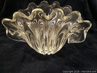 Front angled view showing clam shell shape and wavy rim