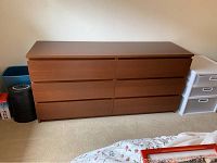 Full frontal view of the 6 drawer dark wood dresser placed against a wall, showing the front and top surface clearly.