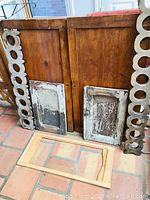 Assorted wood pieces including carved trim, distressed panels, and a wood frame