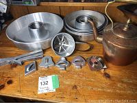 Full lot with cake molds, cookie cutters, garlic press, sifter, and copper kettle