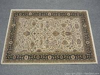 Full view of the carpet laid flat, showing the entire design and border.