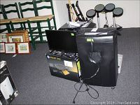 Front view showing HP DeskJet 1055 printer box, Staples shredder, and Insignia 17-inch TV on floor