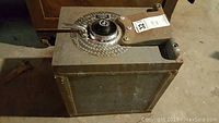Photo of Gary iron safe with visible combination dial and handle on top; showing surface rust patches.