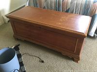 Full view of the wooden hope chest showing overall condition and design