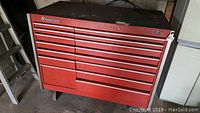 Front view of red Snap-on rolling metal tool chest with 11 drawers