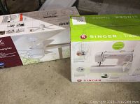 Front view of both Singer sewing machine and ceiling fan boxes