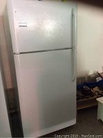 Front view of closed refrigerator showing exterior finish and handles