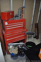 Overview of lot showing red tool chest, portable toolbox, tool organizer, stool, assorted tools