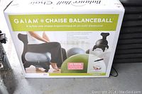 Original packaging box for Gaiam Chaise BalanceBall chair showing ergonomic chair with exercise ball seat.