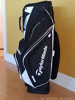 Side view of TaylorMade golf bag showing color and branding
